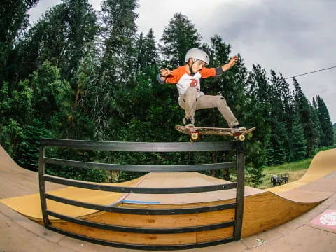 a man riding a skateboard on a rail