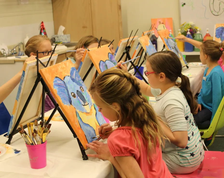 a group of children painting
