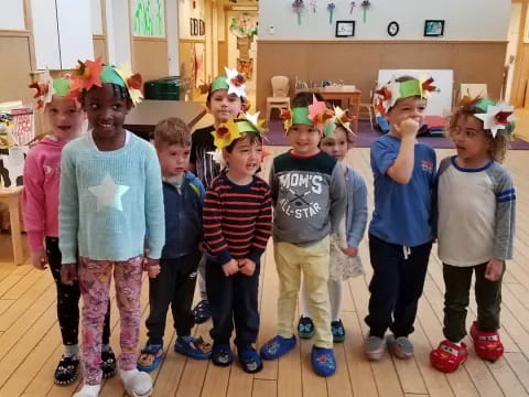 a group of children wearing party hats