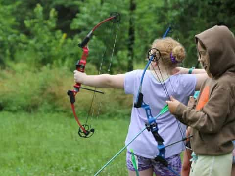 a girl shooting a bow