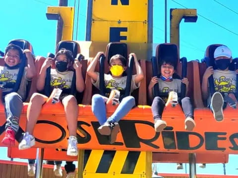 a group of people on a roller coaster