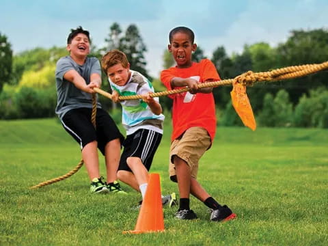 a group of people playing with sticks