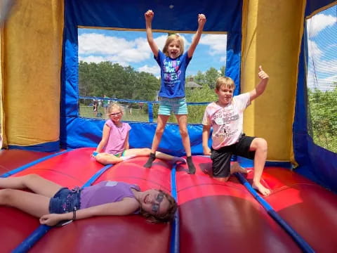 a group of children on a trampoline