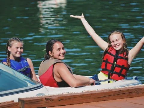 a group of girls in a boat