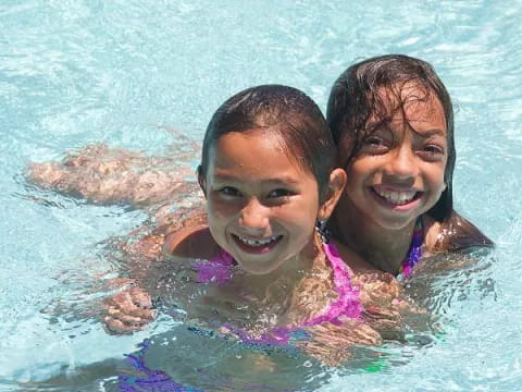 a couple of women in a pool