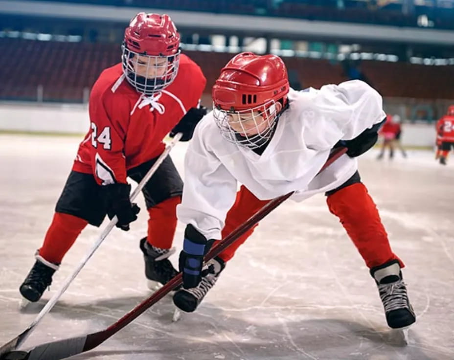 two men playing hockey