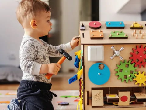 a baby playing with a toy