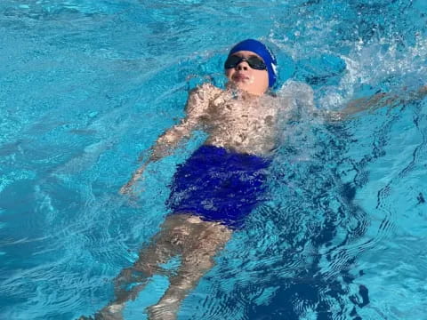 a man swimming in a pool