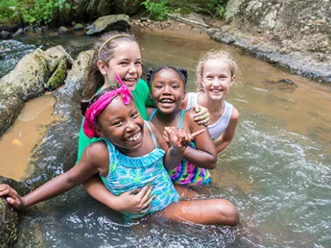 a group of people in a river