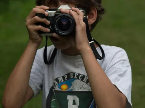 a person holding a camera