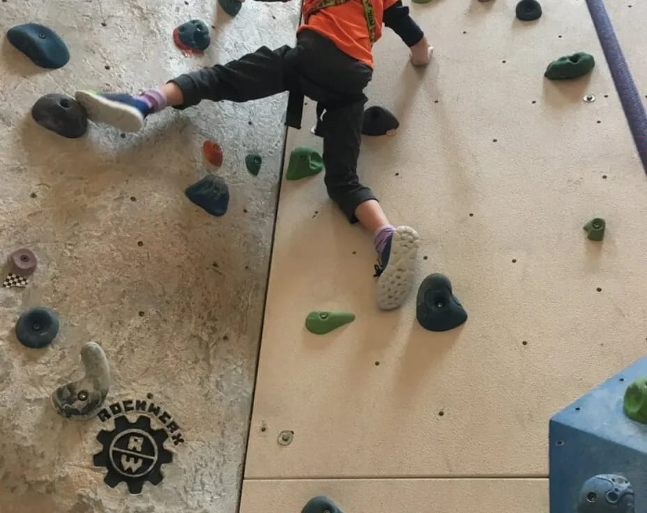 a person climbing a rock wall