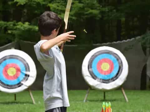 a boy shooting a target