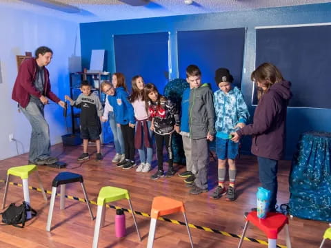 a group of children standing in a room