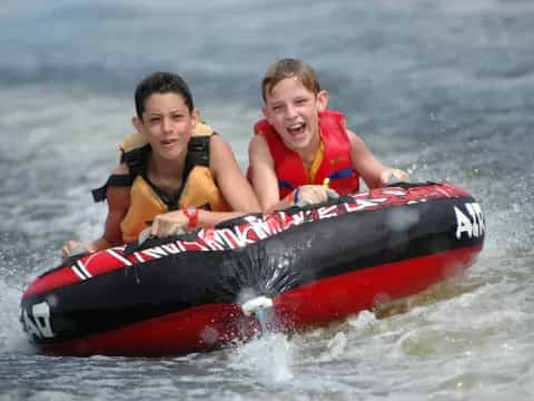 two boys in a raft