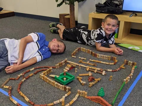 a couple of boys playing with toys