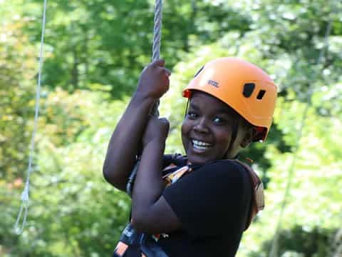 a person wearing a helmet and harness