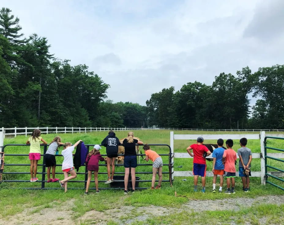 a group of people standing on a field