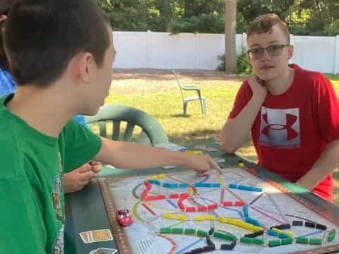 a couple of men playing a board game