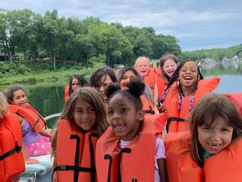 a group of people wearing life vests