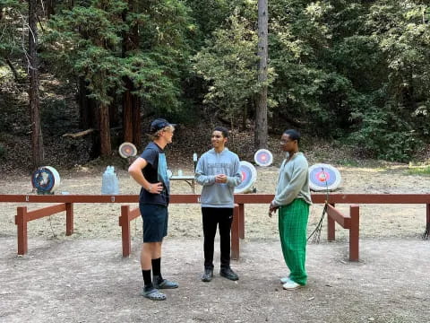 a group of people holding frisbees