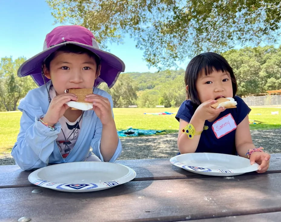 two kids eating food