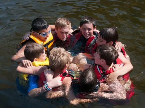 a group of kids in a body of water