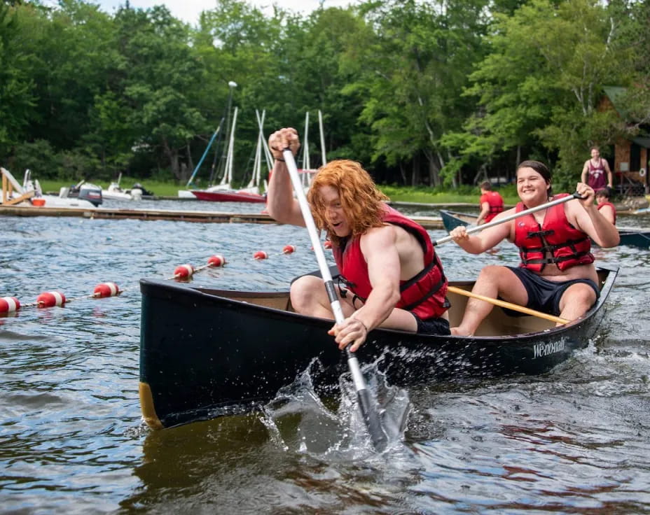 a group of people in a canoe