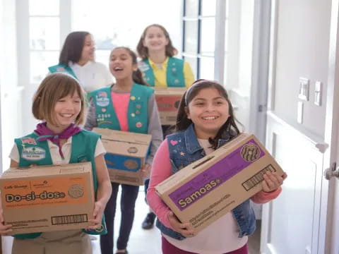 a group of girls holding signs