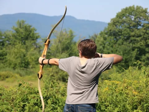 a man holding a bow and arrow