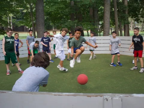 a group of kids playing football