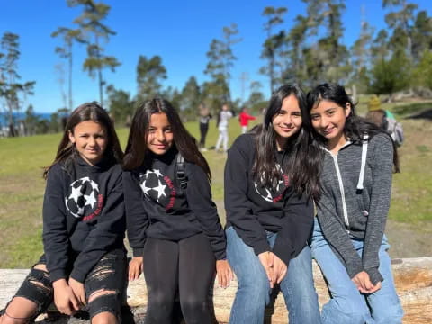 a group of women posing for a photo