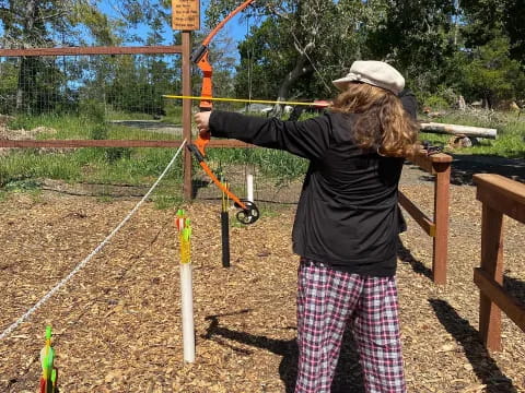 a man shooting a bow