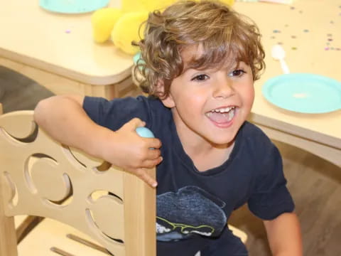 a boy sitting at a table