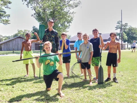 a group of people holding paddles