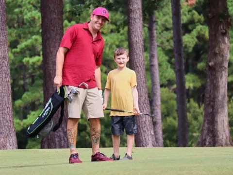 a man and a boy playing golf