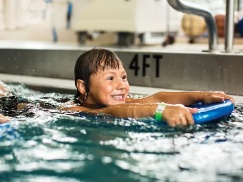 a boy in a pool