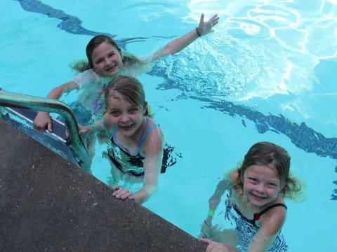 a group of girls in a pool