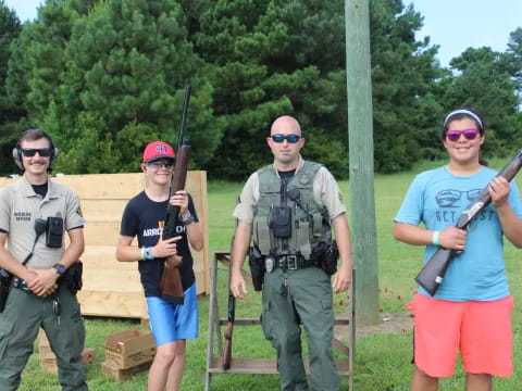 a group of people holding guns