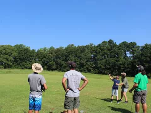 a group of people playing baseball