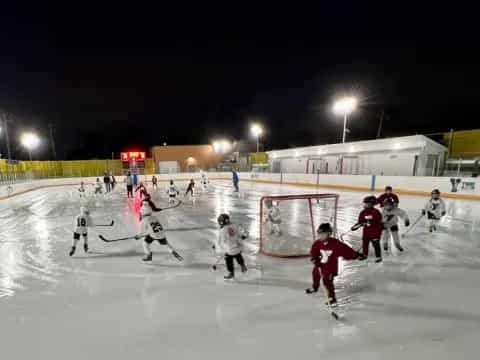 a group of people skating on ice