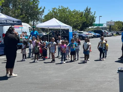 a group of children standing in a line