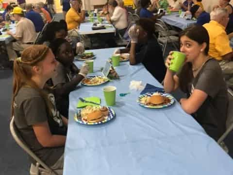 a group of people eating at a table