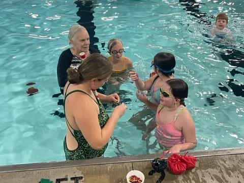 a group of people in a pool