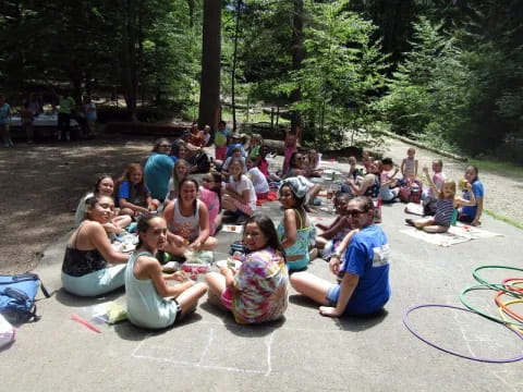 a group of people sitting on the ground