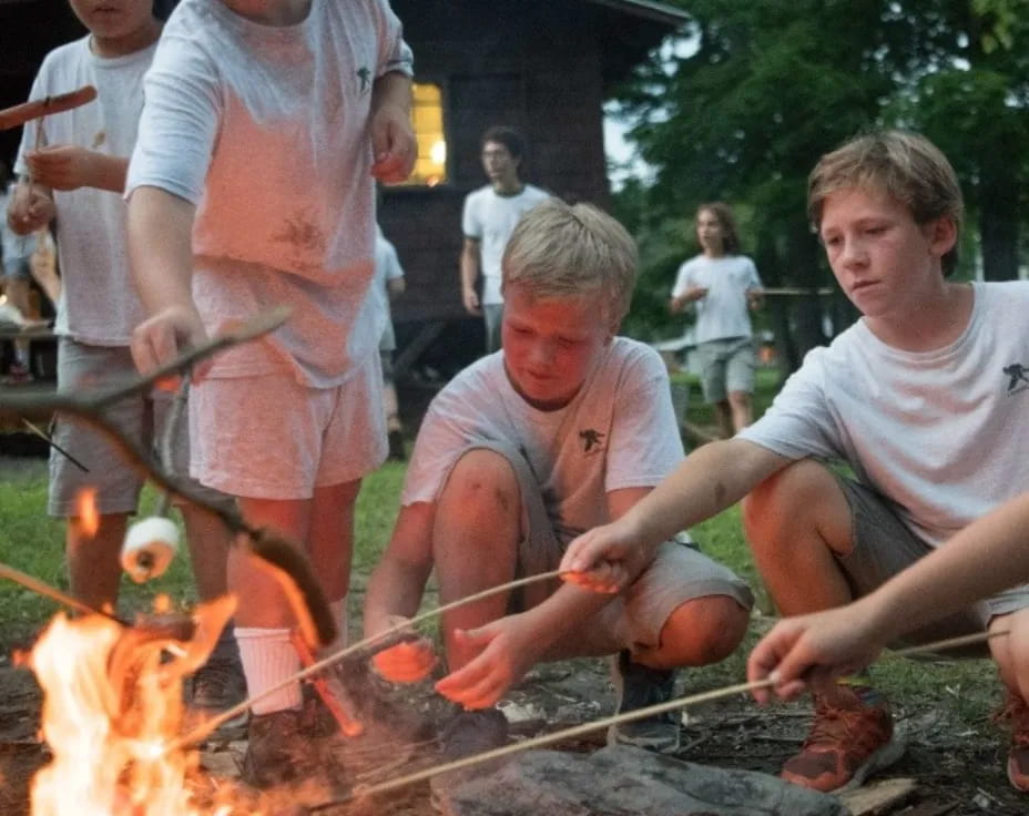 a group of people around a fire