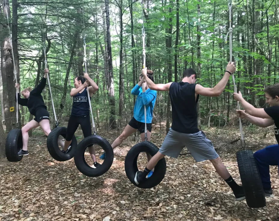 a group of people on exercise equipment