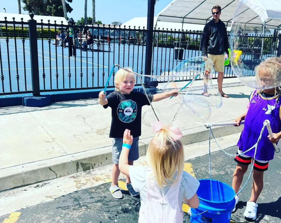 a group of kids playing in a playground