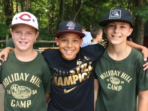 a group of boys wearing baseball caps