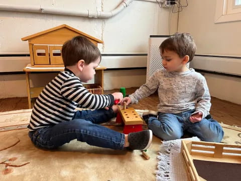 a couple of boys playing with toys