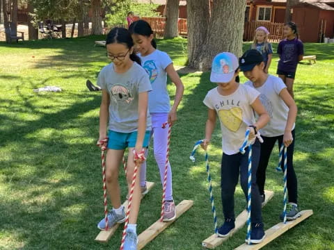 a group of kids holding bows and arrows